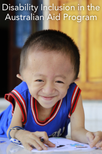 A young boy with hydrocephalus, a medical condition which causes seizures and makes speaking and walking difficult, smiles at the camera. 