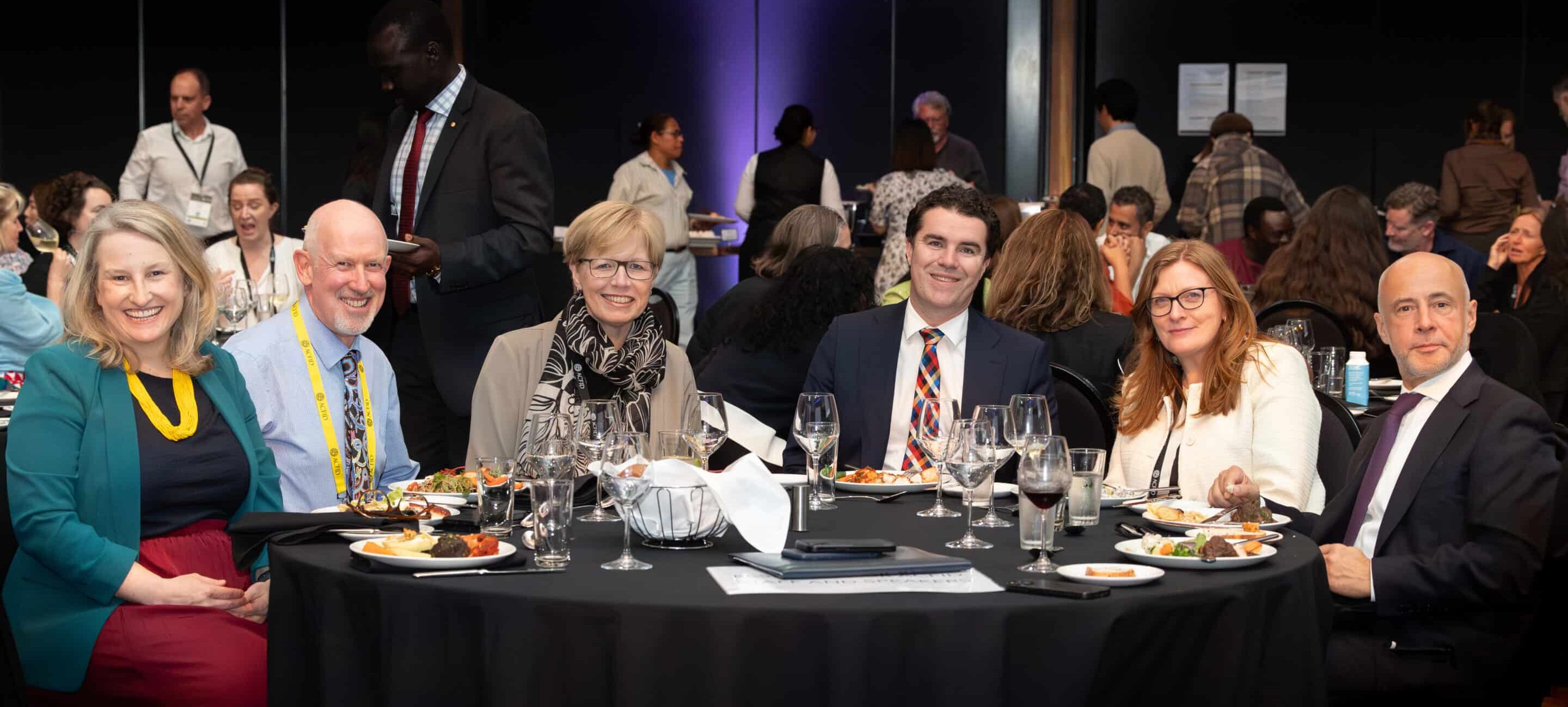 ACFID's 2024 Annual Conference dinner seating, left to right: Jane Chandler, Assistant Secretary, DFAT; Marc Purcell, CEO, ACFID; Jane Edge, CEO, CBM; The Hon Tim Watts MP, Assistant Minister for Foreign Affairs; Michelle Higelin, Executive Director, ActionAid Australia; His Excellency Gabriele Visentin, Ambassador, Delegation of the European Union to Australia.