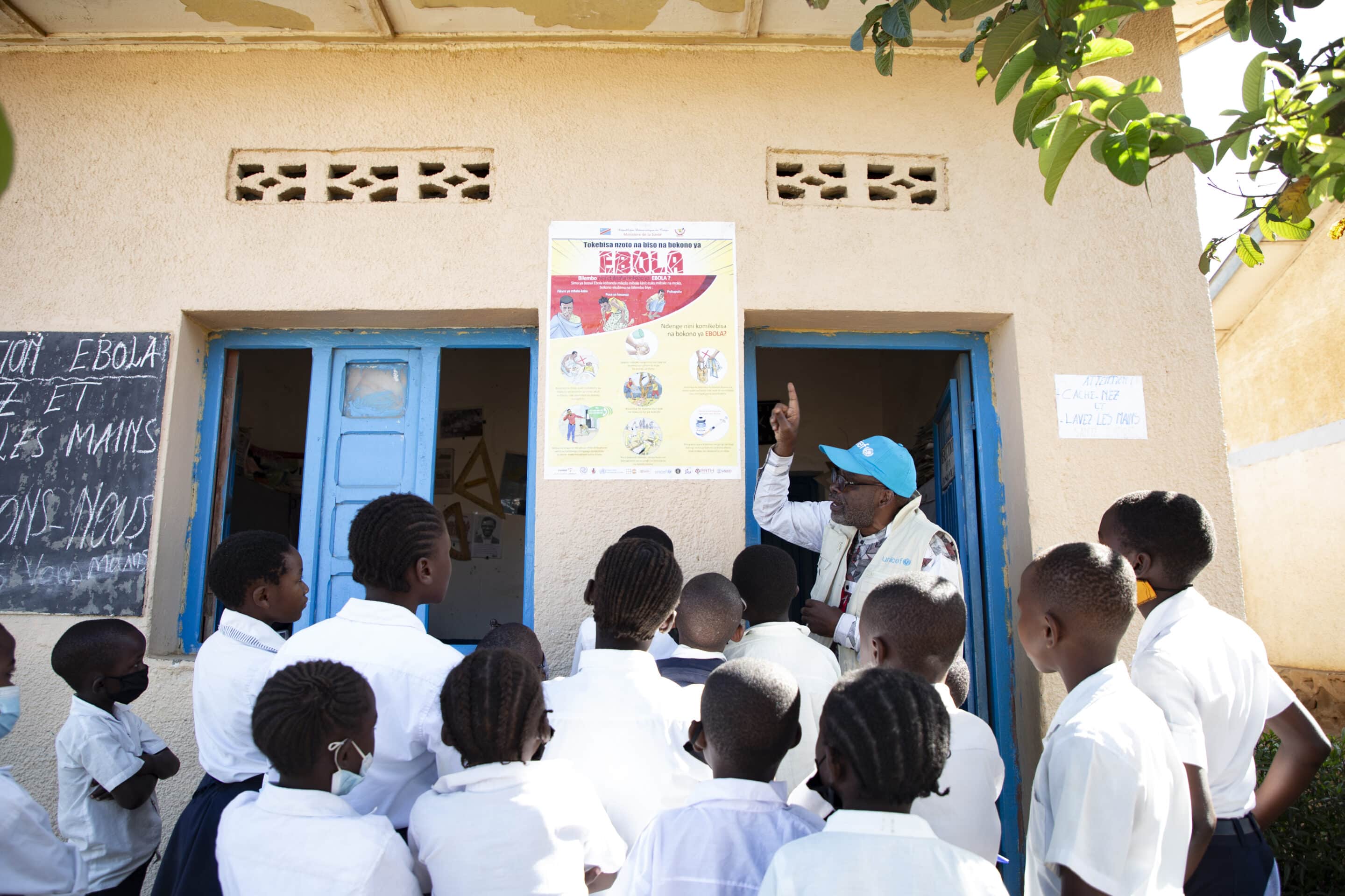 UNICEF WASH Officer explains Ebola prevention measures to pupils at a primary school in Ituri Province, DR Congo.